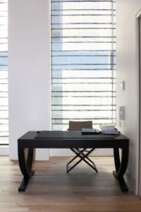 wooden table beside the window