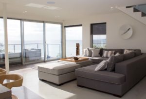 Living room with sofa set and balcony