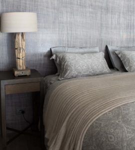 Pillows and wooden bed lamp in bedroom